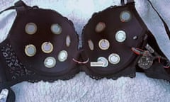A bra with small discs attached and wires coming out of the padding