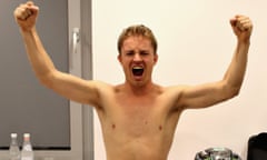 Nico Rosberg raises his arms after retiring