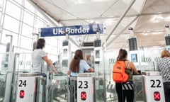 Passengers using electronic passport gates at Stansted airport.