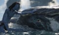 An image from Avatar: The Way of Water, depicting a Na’vi with a whale-like creature.