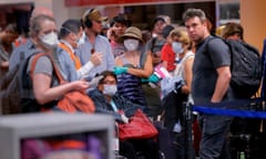 Travellers await flights out of Peru at the Jorge Chavez airport in Lima