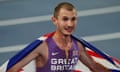 European Athletics Championships<br>Athletics - European Athletics Championships - Stadio Olimpico, Rome, Italy - June 8, 2024 Britain's George Mills celebrates with his national flag after finishing second in the men's 5000m final REUTERS/Aleksandra Szmigiel