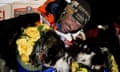 Thomas Waerner with two of his dogs after finishing this year’s race in Nome, Alaska