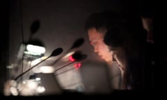 Interpreters work in a sound booth while China’s President Hu Jintao speaks at the 2009 Asia-Pacific Economic Cooperation summit in Singapore.