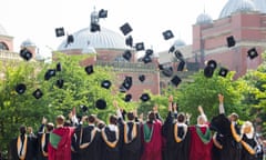 Graduates throw their caps in the air at Birmingham University, UK, after the graduation ceremony.