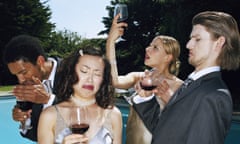 Four young people pulling faces while tasting red wine