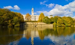 Trent building in the grounds of Nottingham University on sunny day reflected in lake in front of building