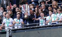 Bolton’s manager, Ian Evatt, celebrates with the trophy after his side’s 4-0 victory over Plymouth in the EFL Trophy final at Wembley.