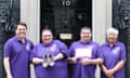 Walk In Our Shoes campaign<br>Hft handout photo of two people with learning disabilities help to deliver a custom-made pair of shoes to the Prime Minister in a bid to encourage Government officials to better understand their lives. PRESS ASSOCIATION Photo. Issue date: Thursday June 7, 2018. The unusual delivery was organised by Hft, a national charity supporting adults with learning disabilities, which has launched a Walk In Our Shoes campaign. The charity is enlisting public support to help facilitate opportunities for people with learning disabilities to share their experiences with politicians. See PA story INDUSTRY Shoes. Photo credit should read: Hft/PA Wire NOTE TO EDITORS: This handout photo may only be used in for editorial reporting purposes for the contemporaneous illustration of events, things or the people in the image or facts mentioned in the caption. Reuse of the picture may require further permission from the copyright holder.