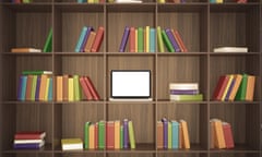 Library with wooden shelf and multicolored books and laptop on the center shelf.