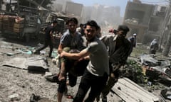 Men transport a casualty after what activists said were airstrikes by forces loyal to Syria's President Bashar al-Assad on a busy marketplace in the Douma neighborhood of Damascus, Syria<br>ATTENTION EDITORS - VISUAL COVERAGE OF SCENES OF DEATH AND INJURY Men transport a casualty after what activists said were airstrikes by forces loyal to Syria's President Bashar al-Assad on a busy marketplace in the Douma neighborhood of Damascus, Syria August 12, 2015. Syrian government air strikes on rebel-held areas near Damascus killed at least 31 people on Wednesday, and insurgents bombarded the capital with rockets that killed at least 13 people, the Syrian Observatory for Human Rights reported.  REUTERS/Bassam Khabieh   NO ARCHIVESTEMPLATE OUT      TPX IMAGES OF THE DAY