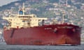 A Russian crude oil tanker in the Bosphorus in Istanbul. Houses fill the hillside behind