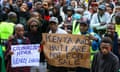 Protesters in Kenya hold signs reading COLONIALISM NEVER REALLY ENDED and KENYA AND HAITI ARE NOT FOR SALE.