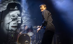 a smiling Brett Anderson of Suede on stage at Electric Brixton