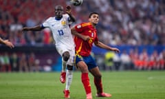 N'Golo Kanté battles against Rodri of Spain, during Euro 2024