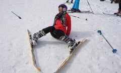 A beginner takes a tumble on a ski slope in the Nepalese village of Kuri