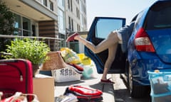 College student reaching in car moving into dorm