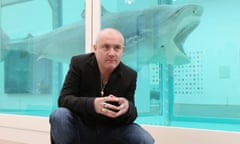 Tate Modern Launch The Damien Hirst Retrospective<br>LONDON, ENGLAND - APRIL 02:  Artist Damien Hirst poses in front of his artwork entitled 'The Physical Impossibility of Death in the Mind of Someone Living' in the Tate Modern art gallery on April 2, 2012 in London, England. The Tate Modern is displaying the first major exhibition of Damien Hirst's artworks in the UK, bringing together the collection over 70 of Hirst's works spanning three decades. The exhibition opens to the general public on April 4, 2012 and runs until September 9, 2012.  (Photo by Oli Scarff/Getty Images)