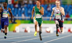 Athletics - Men's 100m - T44 Round 1 Heat 1<br>2016 Rio Paralympics - Athletics - Men's 100m - T44 Round 1 Heat 1 - Olympic Stadium - Rio de Janeiro, Brazil - 08/09/2016. Jonnie Peacock of Britain (R) competes to win his heat ahead of second placed finisher Arnu Fourie of South Africa (C) and fourth placed Jerome Singleton of the United States. REUTERS/Jason Cairnduff FOR EDITORIAL USE ONLY. NOT FOR SALE FOR MARKETING OR ADVERTISING CAMPAIGNS.