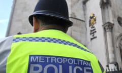 A Metropolitan police officer outside the Royal Courts of Justice in central London