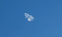 The suspected Chinese spy balloon drifts to the ocean after being shot down off the coast of the US.