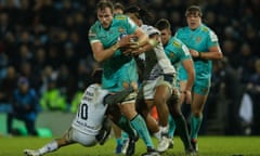 Exeter Chiefs' Scottish lock Jonny Gray is tackled during the European Rugby Champions Cup match between Exeter Chiefs and Montpellier at Sandy Park Stadium.