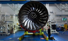 A worker inspecting a Trent XWB aero engine at the Rolls-Royce factory in Derby