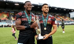 Maro Itoje and Andy Christie pose with the Championship trophy.