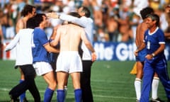 Italy’s manager Enzo Bearzot embraces his players at the end as they celebrate victory.
