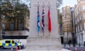 Flags on the Cenotaph monument, which is surrounded by cones, with a police van parked nearby on, 7 November 2023