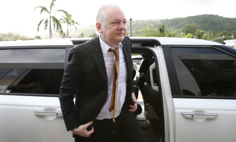 Julian Assange arrives at court in Saipan.