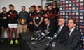 James Hird fronts the media alongside Bombers CEO Xavier Campbell (L) and chairman Paul Little as Bombers players look on at True Value Solar Centre.