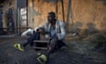 A man listens to the news on the radio in Bujumbura, following the contested presidential election