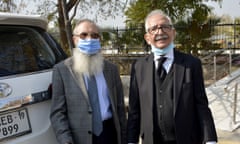 Mehmood A Sheikh, right, defence lawyer, and Ahmed Saeed Sheikh, the father of Ahmed Omar Saeed Sheikh, leave the supreme court in Islamabad, Pakistan.