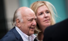 Roger Ailes walks with his wife Elizabeth Tilson as they leave the N ews Corp building in New York City on Tuesday.