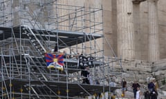 Tibetan flag and a banner on scaffolding