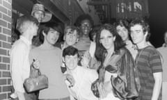 A group of young people–including Tommy Lanigan -Schmidt on the far right–celebrate outside the boarded-up Stonewall Inn (53 Christopher Street) after riots over the weekend of June 27, 1969.