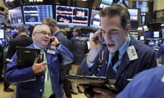 Traders work on the floor of the New York stock exchange.