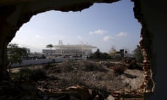 Construction work for the Olympic Park is seen from a partially demolished house in Rio de Janeiro’s Vila Autódromo favela last July