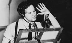 Orson Welles narrates the radio version of The War of the Worlds in a New York studio on 30 October 1938