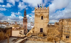 Spain, Andalusia, Carmona, Alcazar puerta de Sevilla (Seville Gate) with San Pedro church in background<br>Alcazar puerta de Sevilla (Seville Gate) with San Pedro church in the background, Carmona, Andalusia, Spain