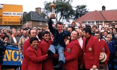 The US team lift captain Jack Burke Jr as they pose for a team photo with the trophy in 1973