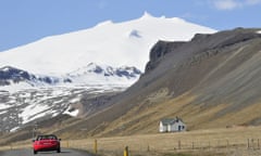 Glacier with red car and small white house in foreground