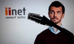 **FILE** A Wednesday, Aug. 20, 2014 image of an ethernet cable in front of the logo of internet service provider iiNet displayed on a computer screen in Canberra. TPG Telecom says it will acquire iiNet in a deal valued at $1.4 billion, making it the second biggest fixed line broadband provider in Australia. (AAP Image/Lukas Coch) NO ARCHIVING
