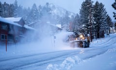 A snow plow clears a road in Mammoth Lakes, California, on 3 January 2024.