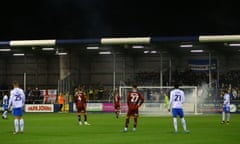 Smoke fills the penalty area after a firework was thrown on to the pitch at Barrow v Carlisle United in the Papa John’s Trophy.