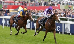 Minding, ridden by Ryan Moore, wins the Oaks at Epsom.