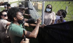 Tulsa Race Massacre descendant Heather Nash, left, yells at Brenda Alford, a graves oversight committee member, and forensic anthropologist Dr Phoebe Stubblefield.