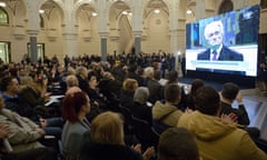 The crowd applauds as the UN court’s sentencing of Radovan Karadžić is broadcast in Sarajevo city hall