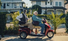 A man and woman on a scooter